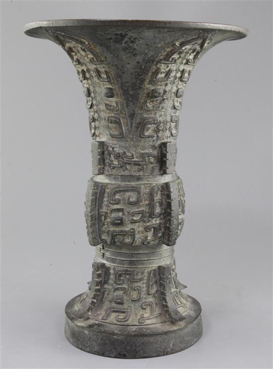 A Chinese archaic bronze ritual wine vessel, Zun, late Shang/early Western Zhou dynasty, 35.5cm high, split to foot